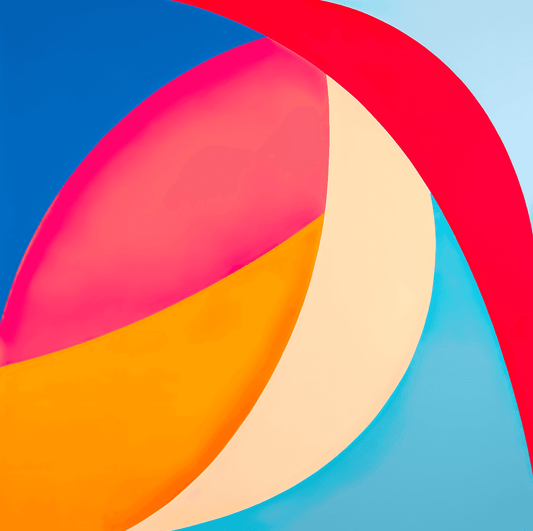 a multicolored beach ball sitting on top of a blue surface